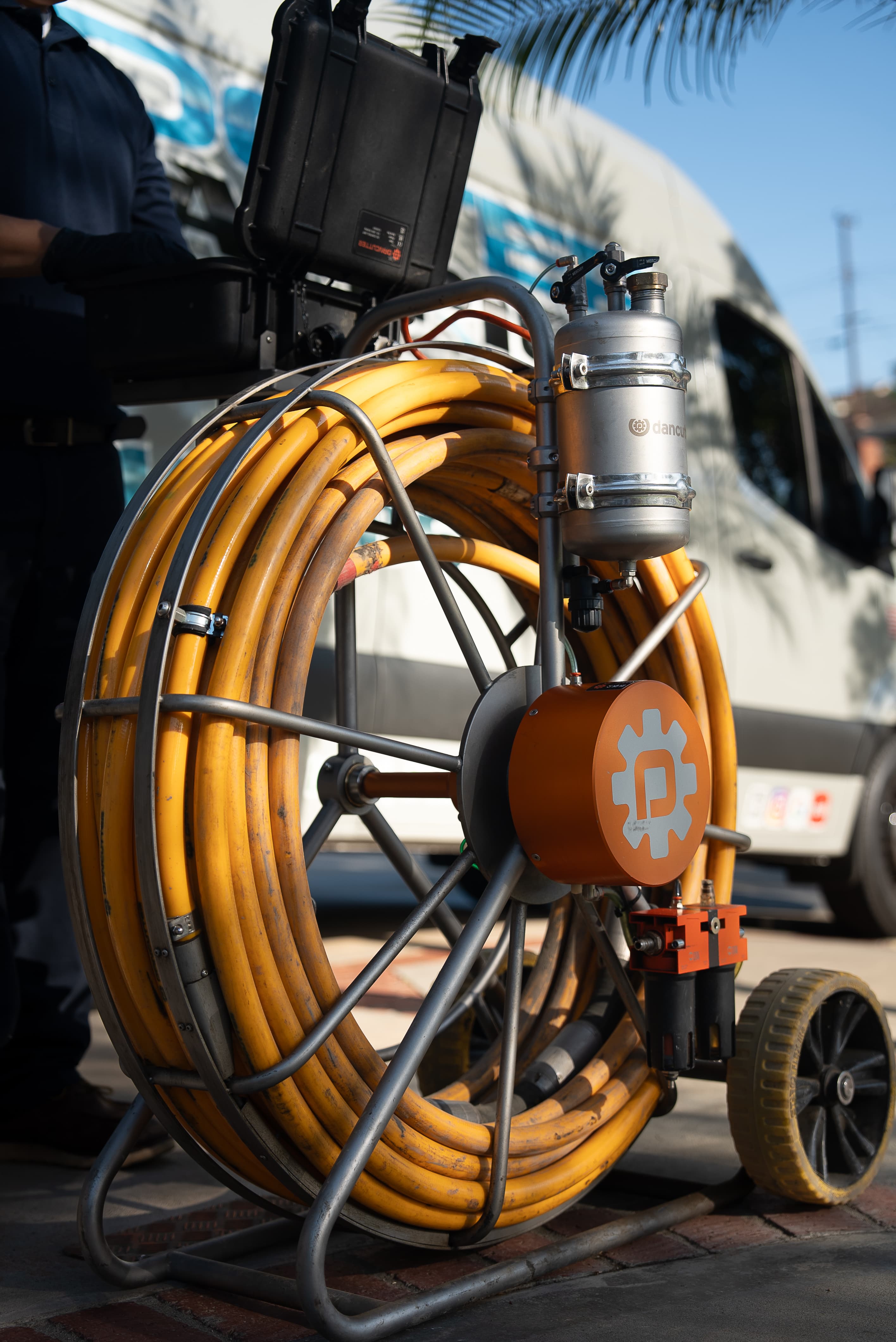 Rooter Champion tech operating the DanCutter sewer robotics system